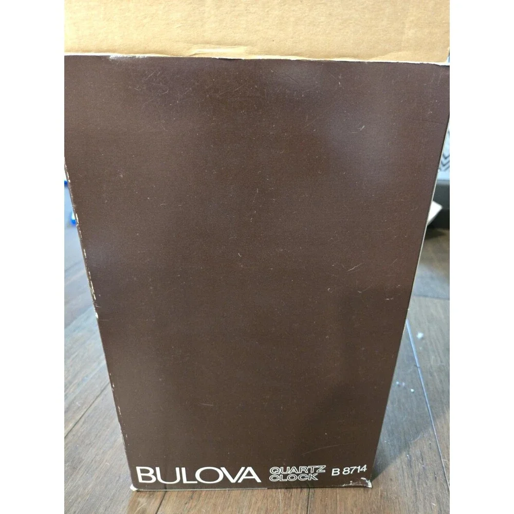 Bulova Tristan I B8818 Anniversary Clock - Glass Dome, Rotating Crystal Pendulum